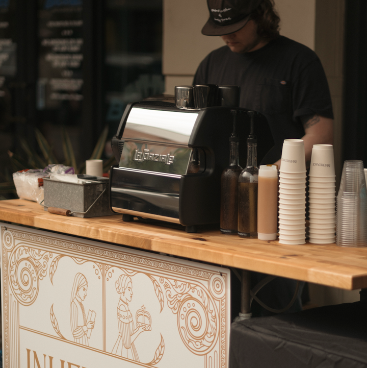 Coffee bar with espresso machine and cups ready to serve - church coffee ministry ideas from Inheritance Coffee, Pensacola, FL