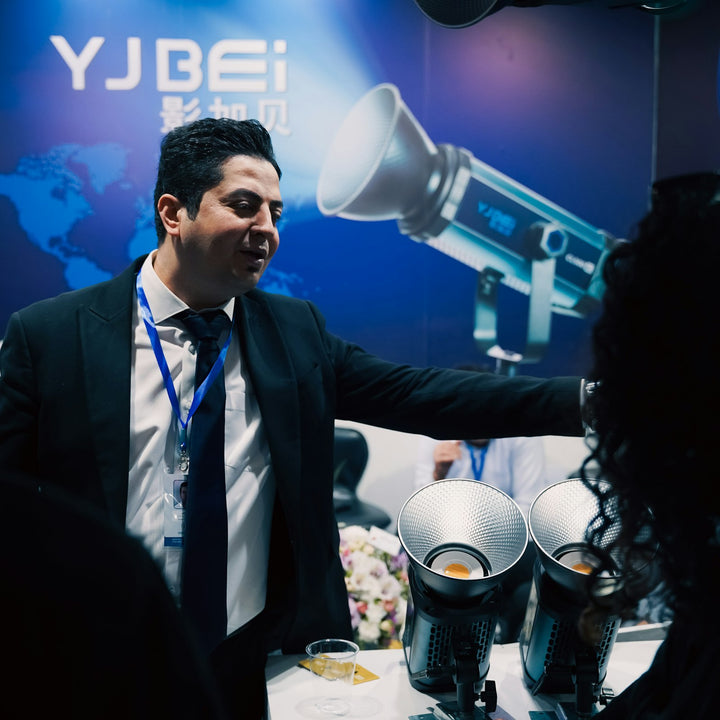 An exhibitor presenting equipment at his stand on a trade show floor - Inheritance Coffee, Pensacola, FL roaster for cafes, churches and coffee startups