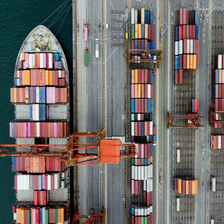 Aerial view of a container ship loaded with shipping containers at a port