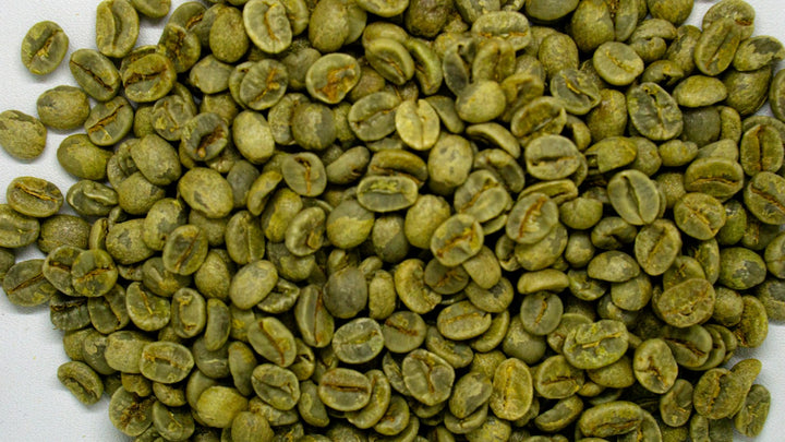A pile of unroasted green coffee beans