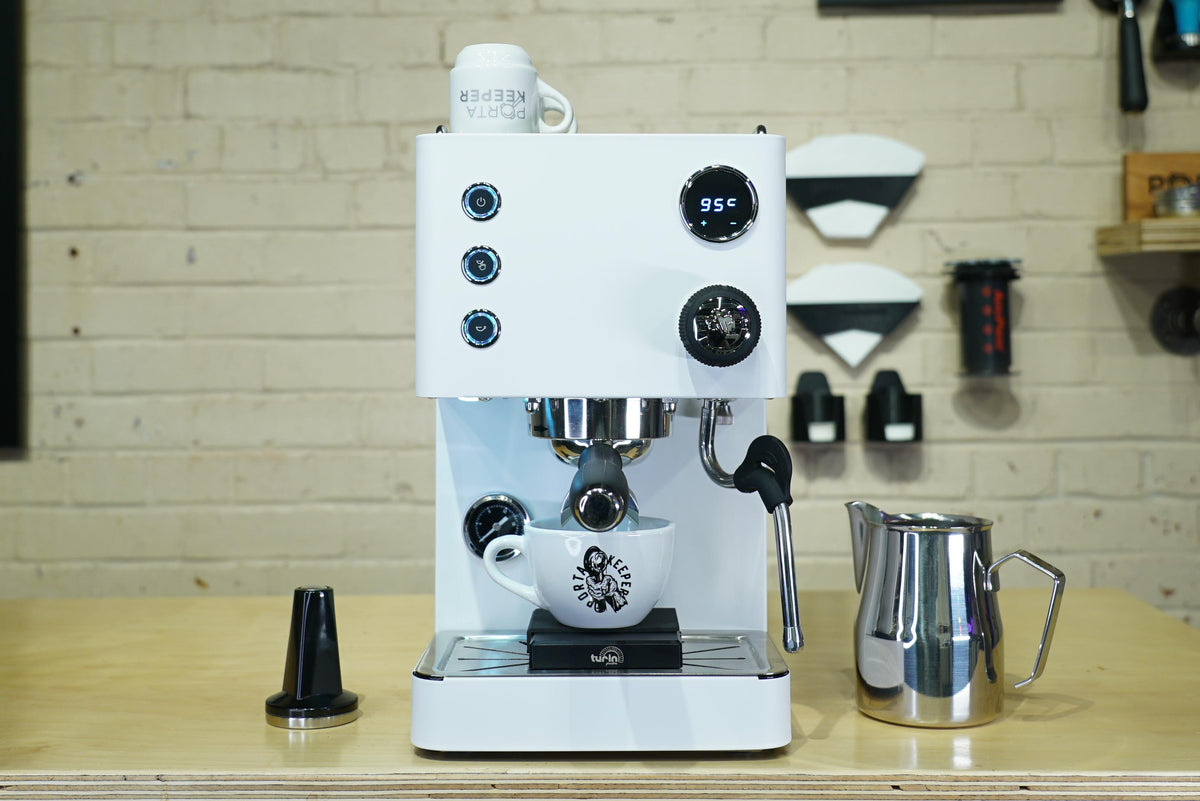 Turin Legato V2 cream espresso machine on a coffee bar with accessories - equipment from Inheritance Coffee, Pensacola, FL serving cafes, churches and home brewers
