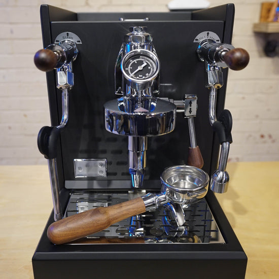 Turin Gallatin V black espresso machine on a bar, from Inheritance Coffee in Pensacola, FL for home brewers and cafes