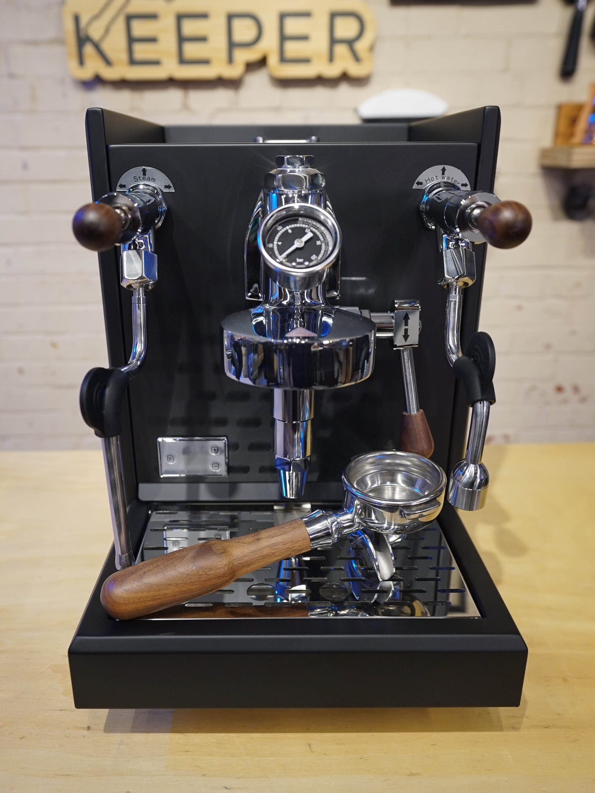 Turin Gallatin V black espresso machine on a bar, from Inheritance Coffee in Pensacola, FL for home brewers and cafes