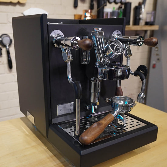 Turin Gallatin V HX espresso machine in black on a coffee bar, for home baristas and cafes from Inheritance Coffee in Pensacola, FL