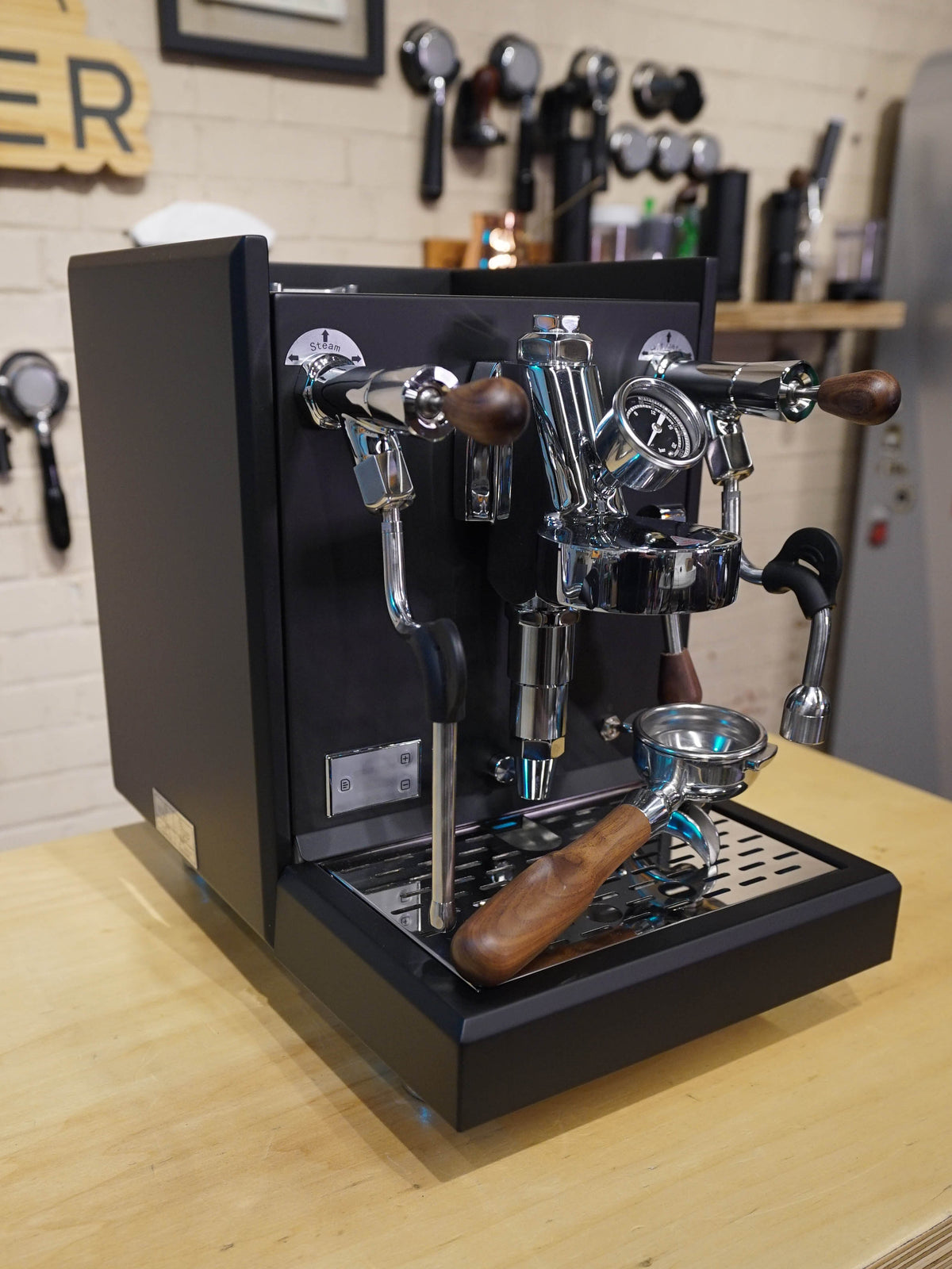 Turin Gallatin V HX espresso machine in black on a coffee bar, for home baristas and cafes from Inheritance Coffee in Pensacola, FL