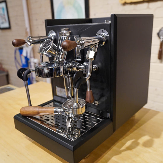 Turin Gallatin V black espresso machine with wood-handled portafilter, from Inheritance Coffee in Pensacola, FL for home brewers and cafes