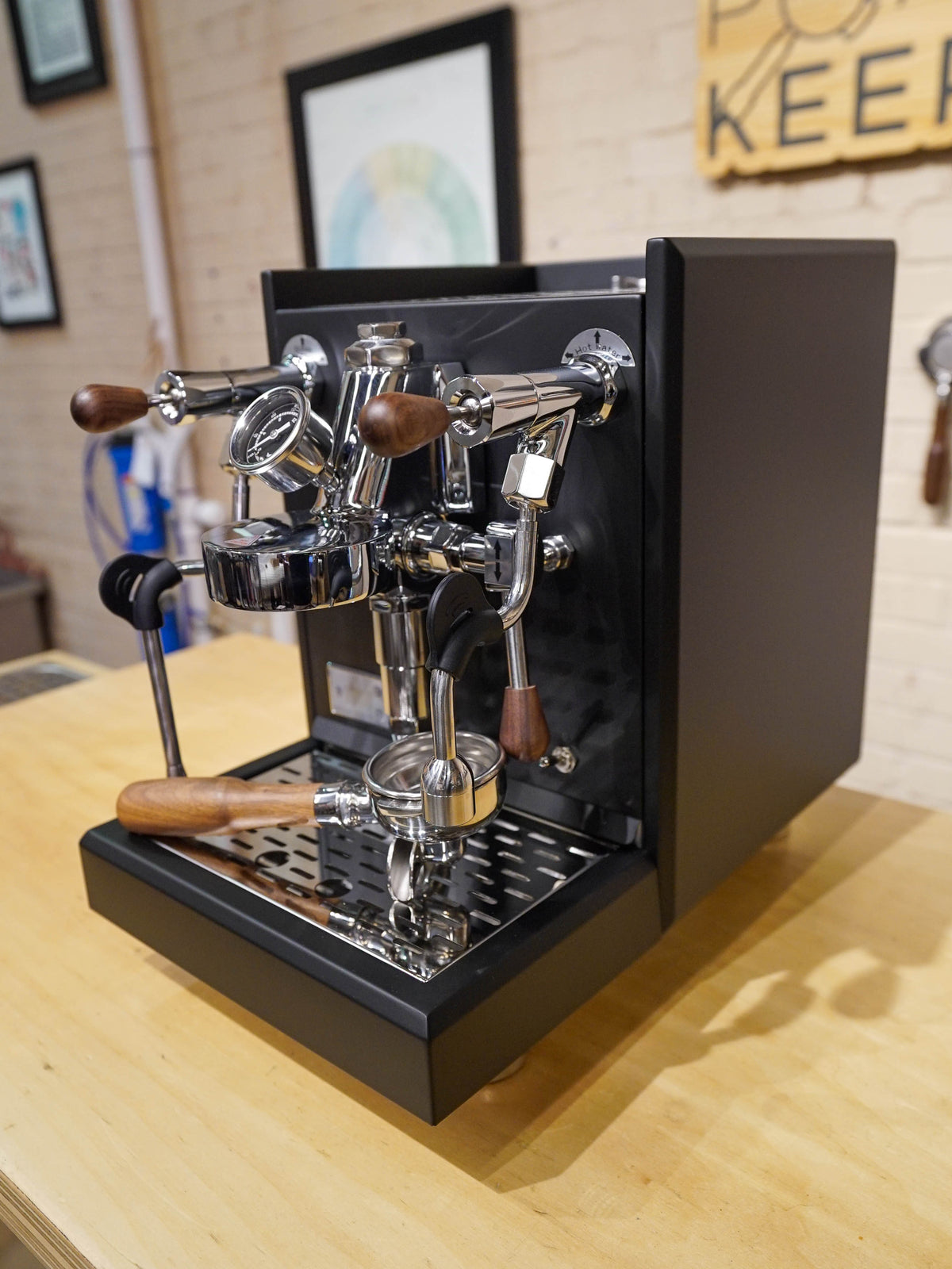 Turin Gallatin V black espresso machine with wood-handled portafilter, from Inheritance Coffee in Pensacola, FL for home brewers and cafes