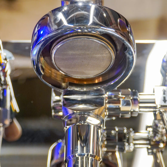 Turin Gallatin V portafilter locked into the group head, from Inheritance Coffee in Pensacola, FL for home brewers and cafes