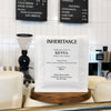 Bag of Kenya Kiambu coffee on a cafe counter by the grinder, roasted by Inheritance Coffee in Pensacola, FL for home brewers and cafes