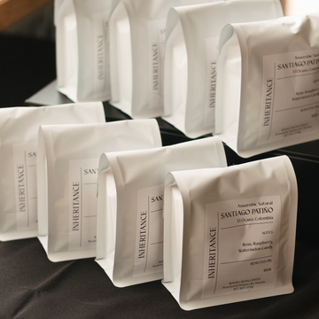 White bags with labels on a dark surface