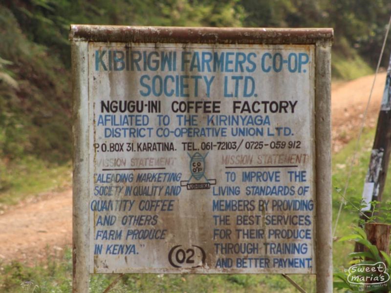 Signboard of Kibrigwi Farmers Co-op Society Ltd. in a natural setting